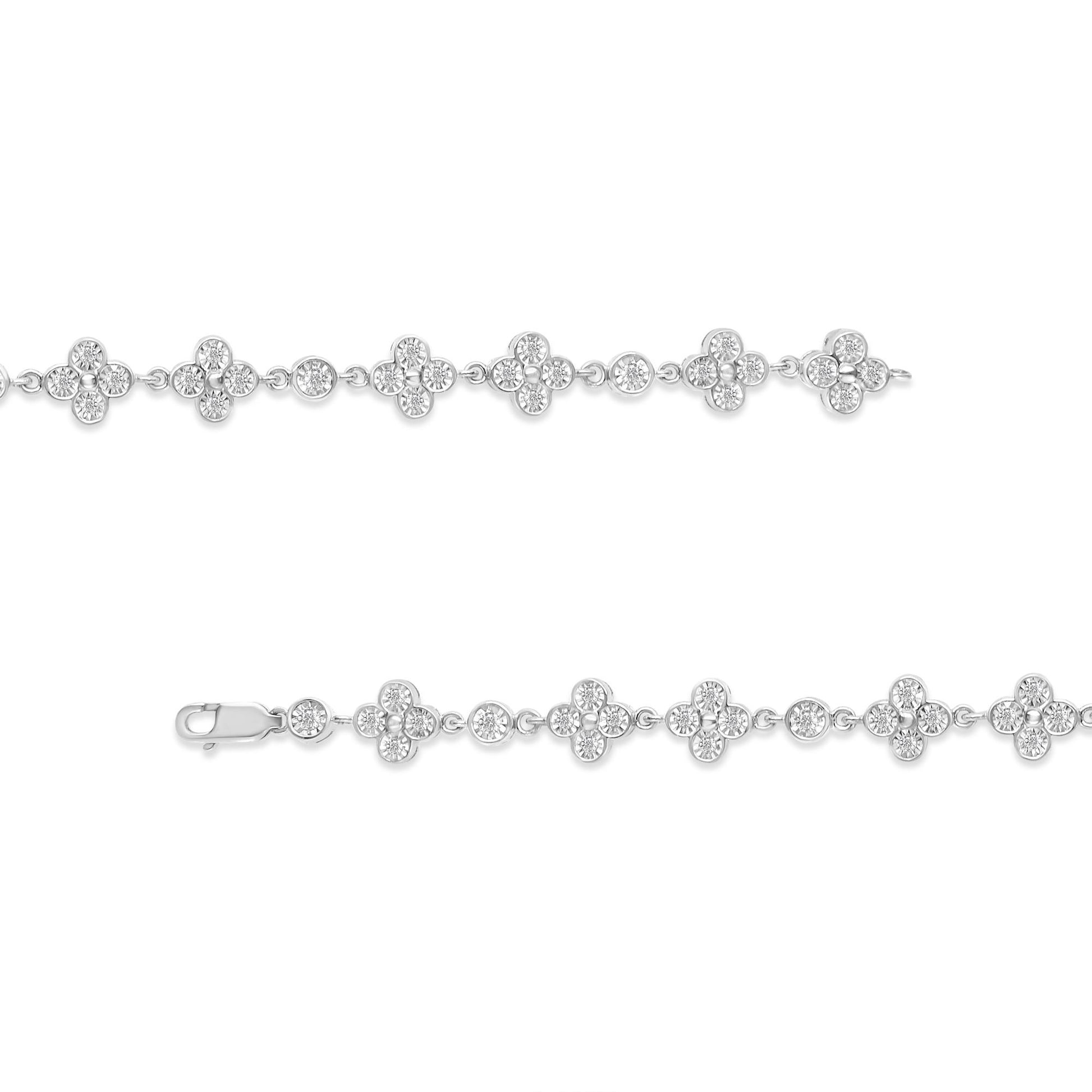 White metal bracelet with alternating round and flower-shaped clusters of white gemstones in miracle settings, shown in a horizontal flat lay from the front angle.
