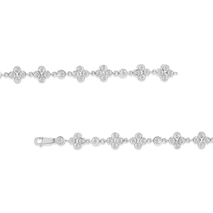 White metal bracelet with alternating round and flower-shaped clusters of white gemstones in miracle settings, shown in a horizontal flat lay from the front angle.
