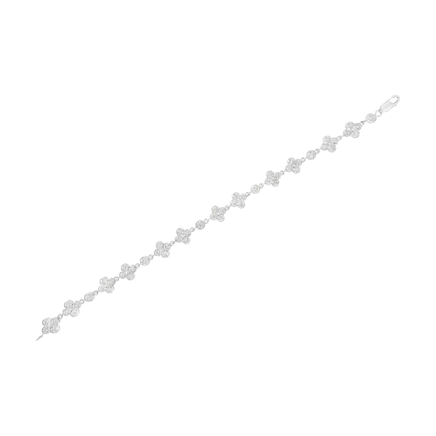 White metal bracelet shown flat from a top-down angle featuring alternating clusters of round white gemstones in a floral pattern and single round white gemstones in miracle settings.