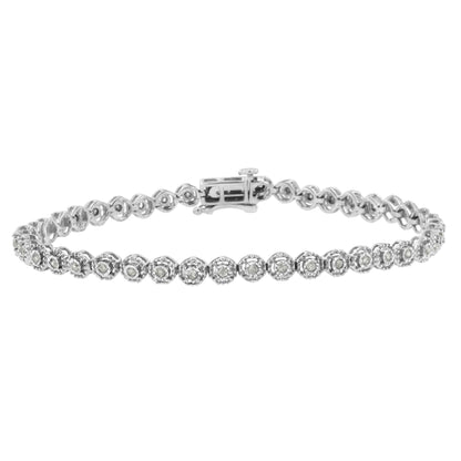 White metal bracelet with round white gemstones in miracle setting, shown from a front angle on a white background.