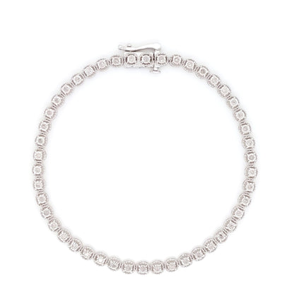Top-down view of a white metal bracelet featuring round white gemstones in a miracle setting, displayed flat on a white background.