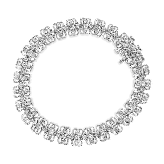 White metal bracelet with an intricate pattern of round white gemstones in a miracle setting, shown from a top-down angle.