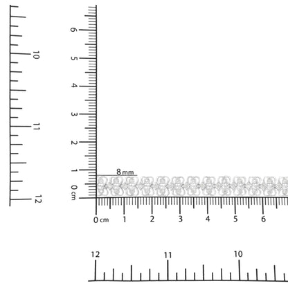 Bracelet with white metal and round white gemstones in miracle setting, placed on a ruler and scale for size reference, shot from above.