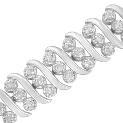 Close-up diagonal view of a white bracelet featuring round prong-set white gemstones in a repeating pattern with smooth curved metal accents.