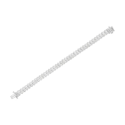 White metal bracelet with spiral design featuring round white gemstones in prong settings, shown from a top-down angle on a white background.