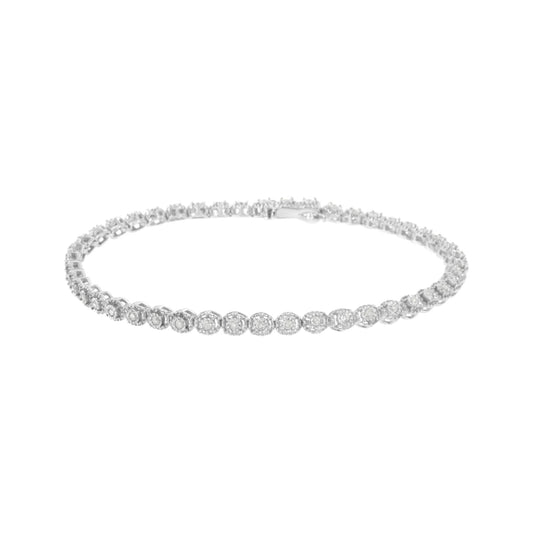 White metal bracelet with round white gemstones in miracle settings, shown in a front angled view.