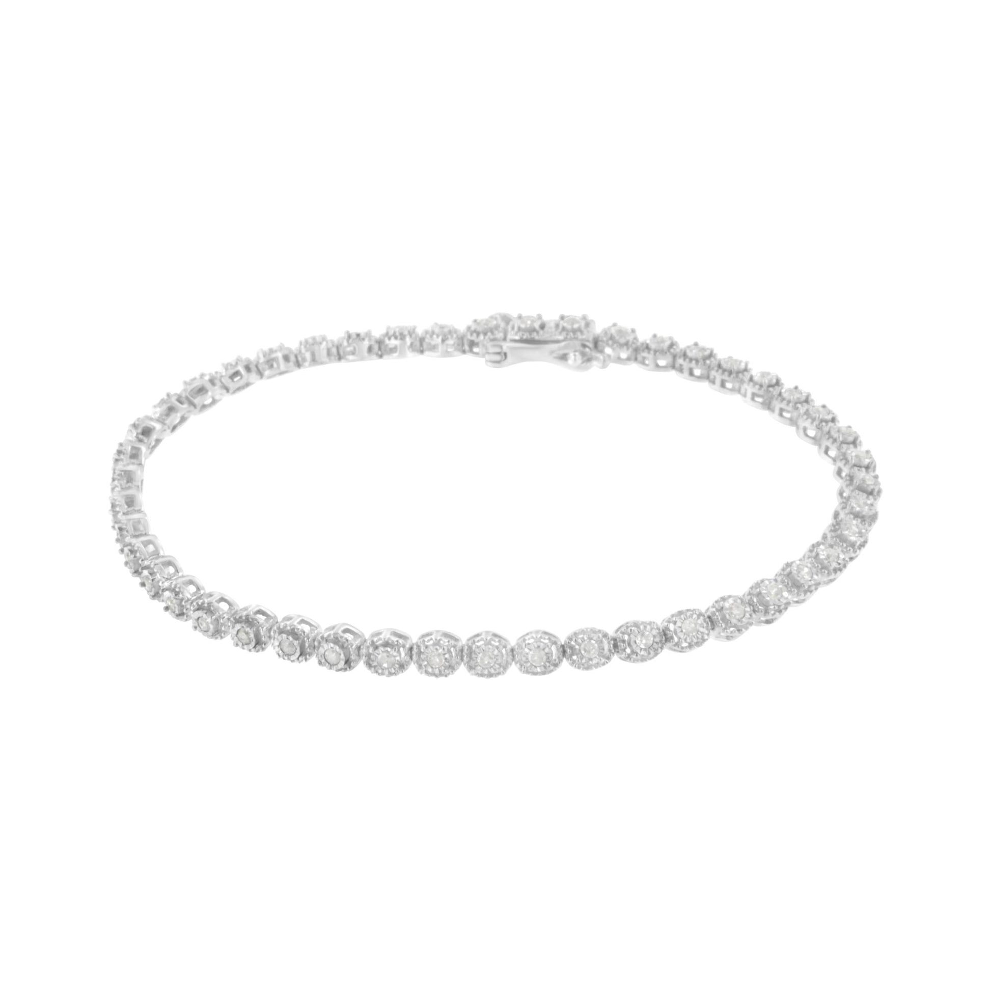 White metal bracelet with round white gemstones in miracle settings, shown from a front angled view.