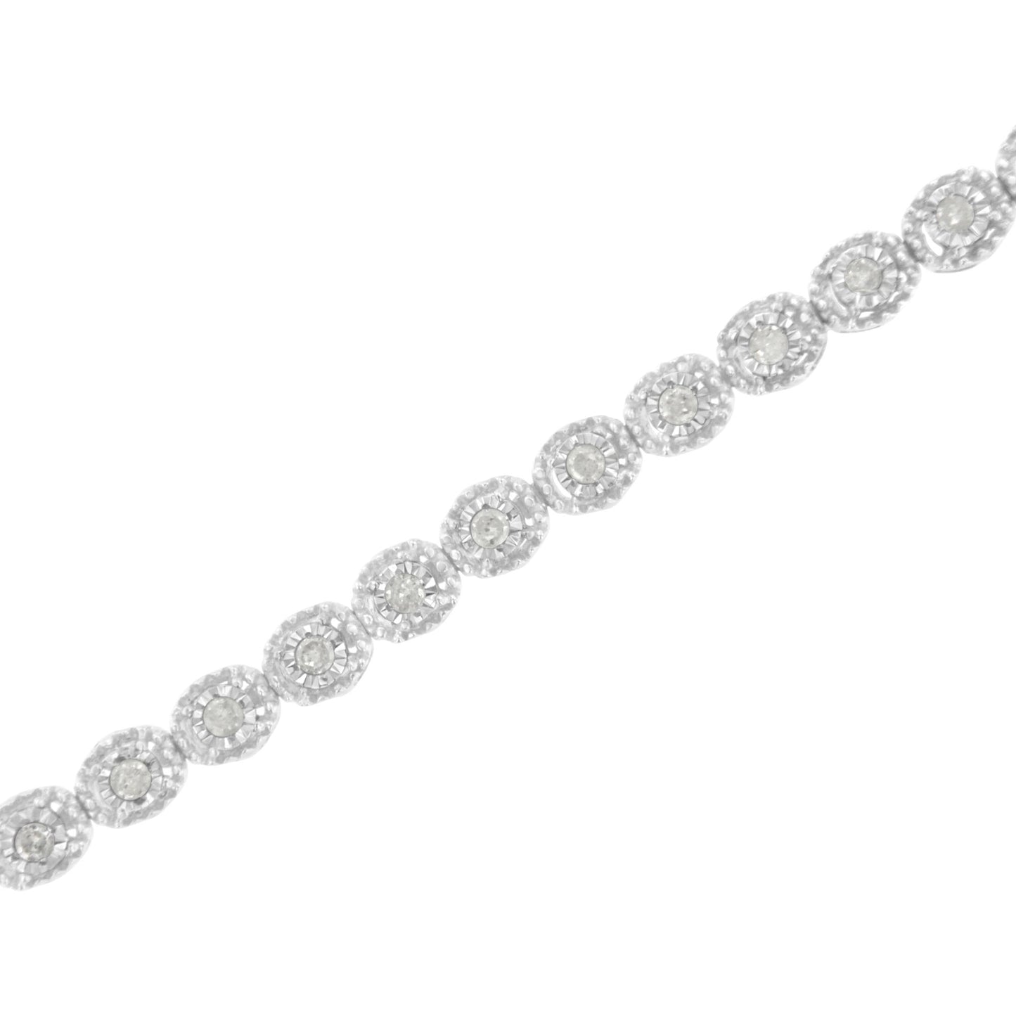 White metal bracelet with round white gemstones in a miracle setting, shown in a diagonal close-up view.