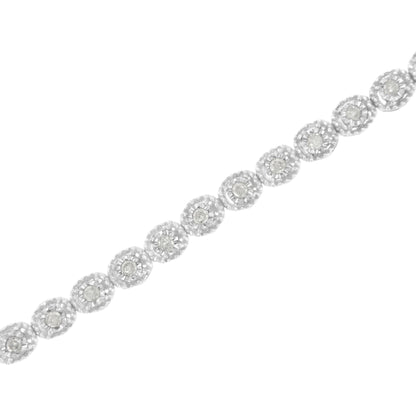 White metal bracelet with round white gemstones in a miracle setting, shown in a diagonal close-up view.