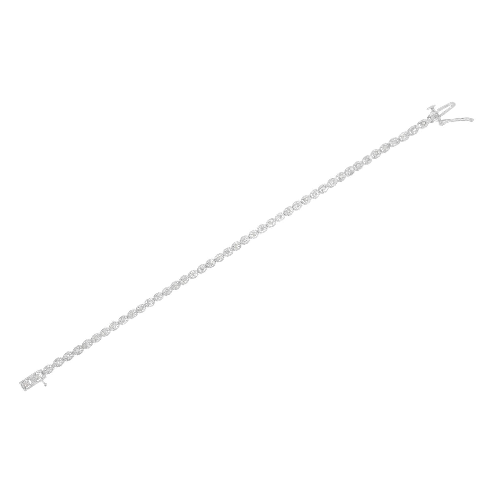 White metal bracelet with round white gemstones set in a line using miracle setting, shown flat on a white background from a top angle.