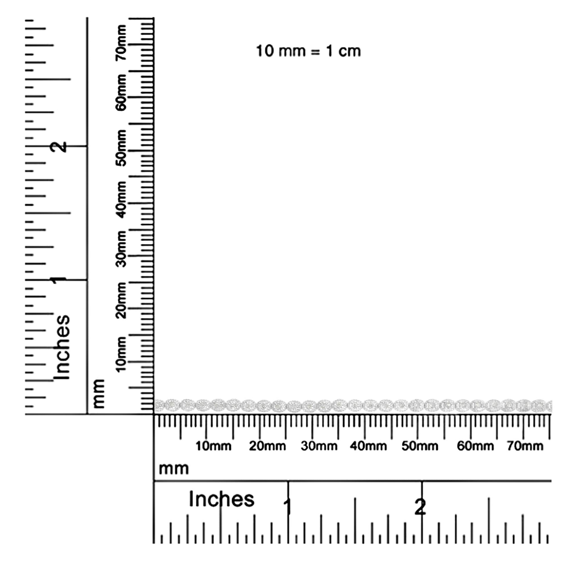 Bracelet with round white gemstones in miracle setting displayed horizontally on rulers for size reference, top-down view.