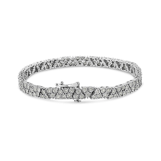 White metal bracelet with round white gemstones in a miracle setting, shown from an angled front view.