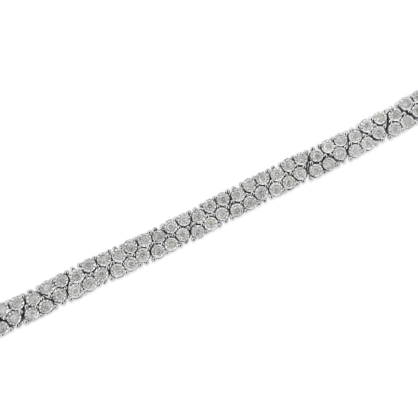 White metal bracelet with round white gemstones in a miracle setting, diagonal close-up view.