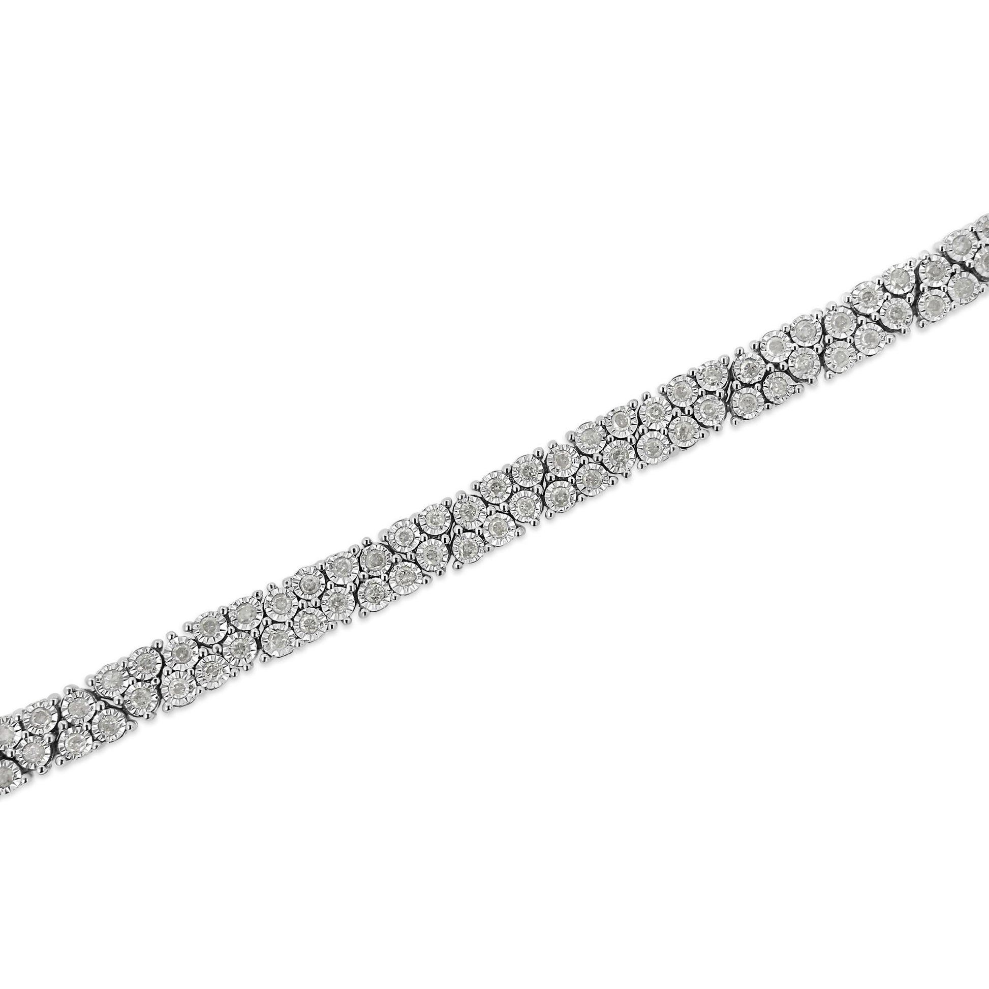 White metal bracelet with round white gemstones in a miracle setting, diagonal close-up view.