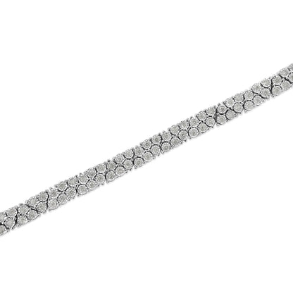 White metal bracelet with round white gemstones in a miracle setting, diagonal close-up view.