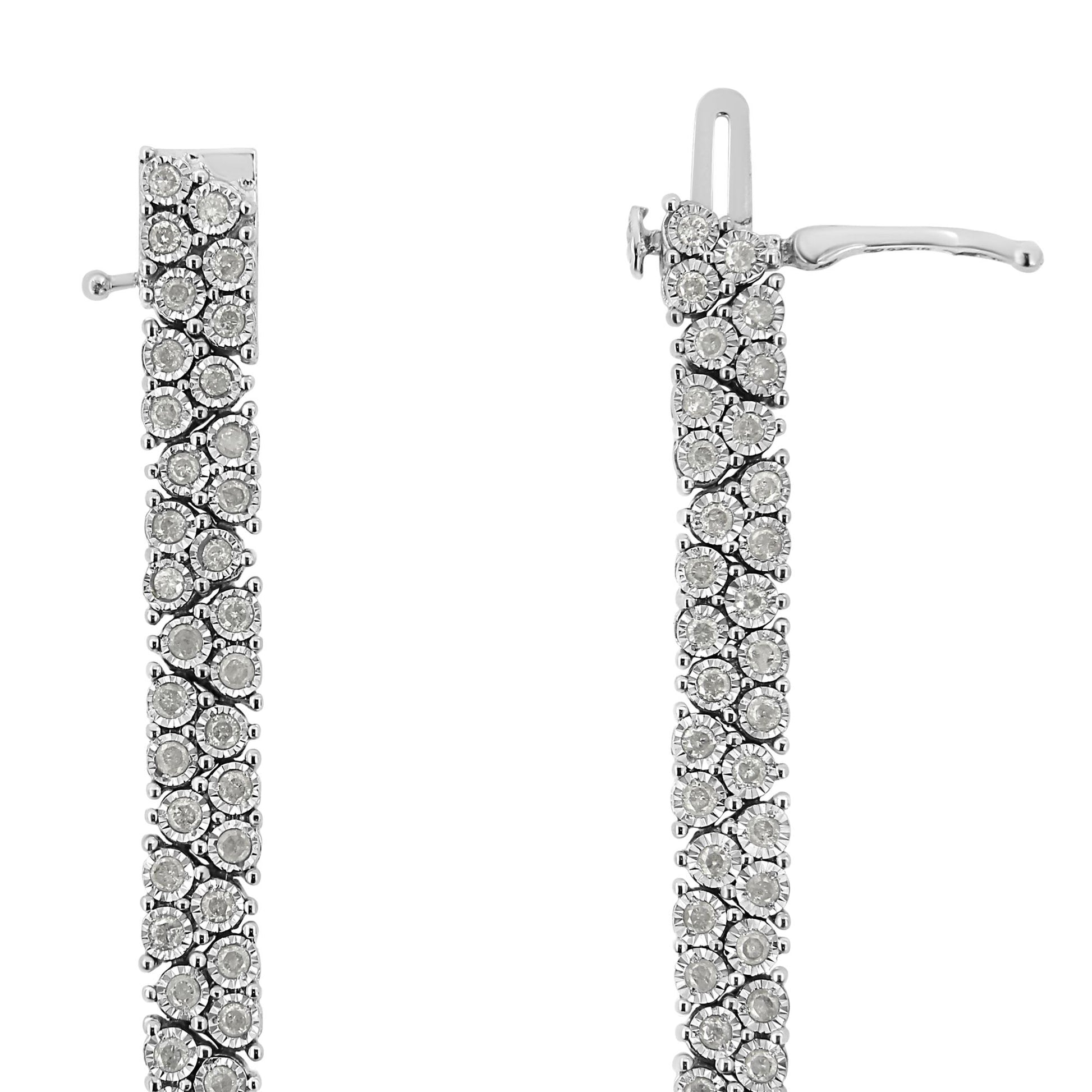 Close-up front view of a white metal bracelet with round white gemstones in miracle setting.