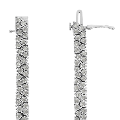 Close-up front view of a white metal bracelet with round white gemstones in miracle setting.