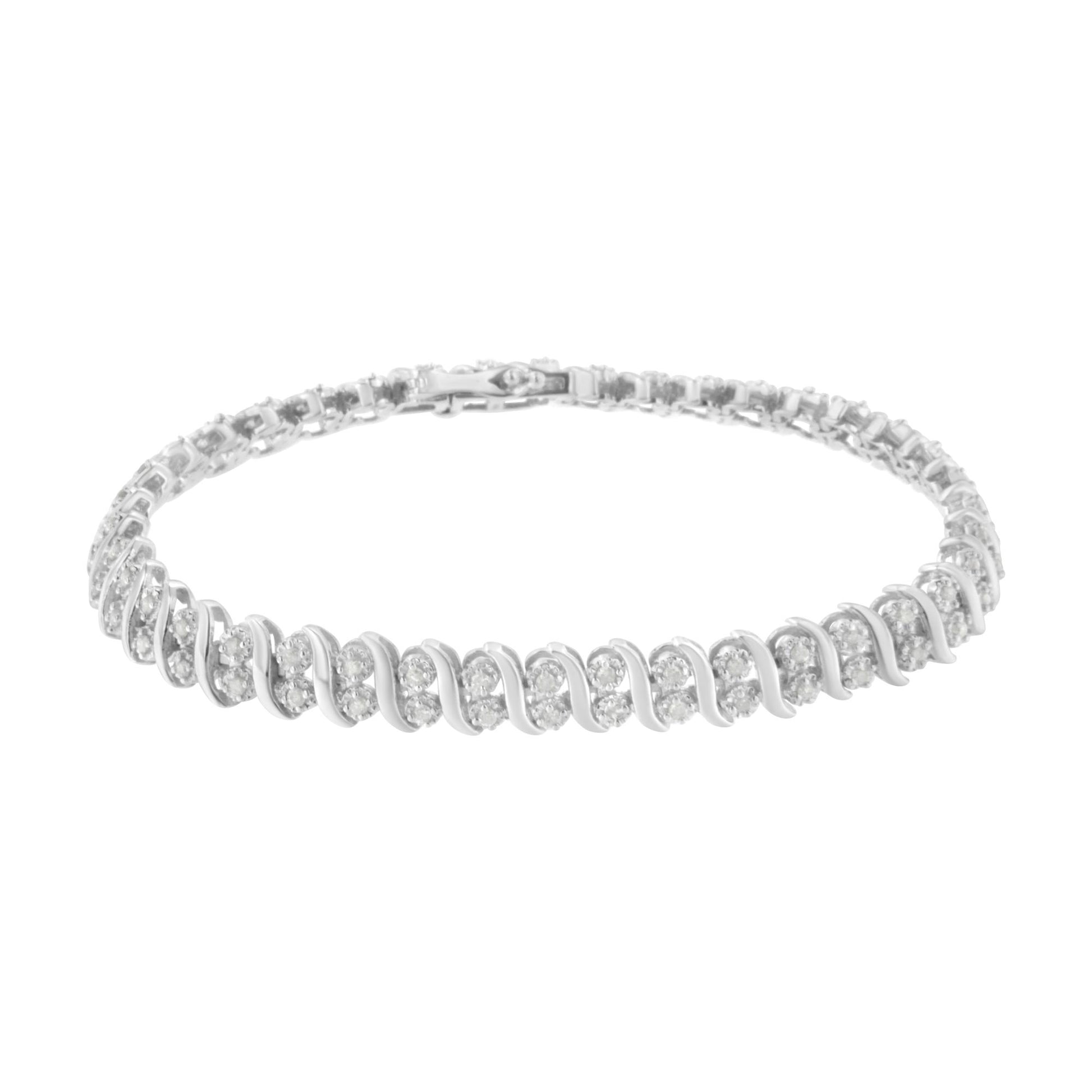White metal bracelet with round white gemstones in pave setting, shown from a front angled view.