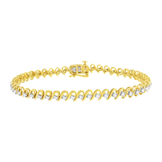 Yellow metal bracelet with round white gemstones in prong settings, shown from front angle.