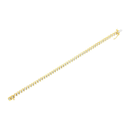 Yellow metal bracelet with prong-set round white gemstones, shown in a diagonal flat lay angle.