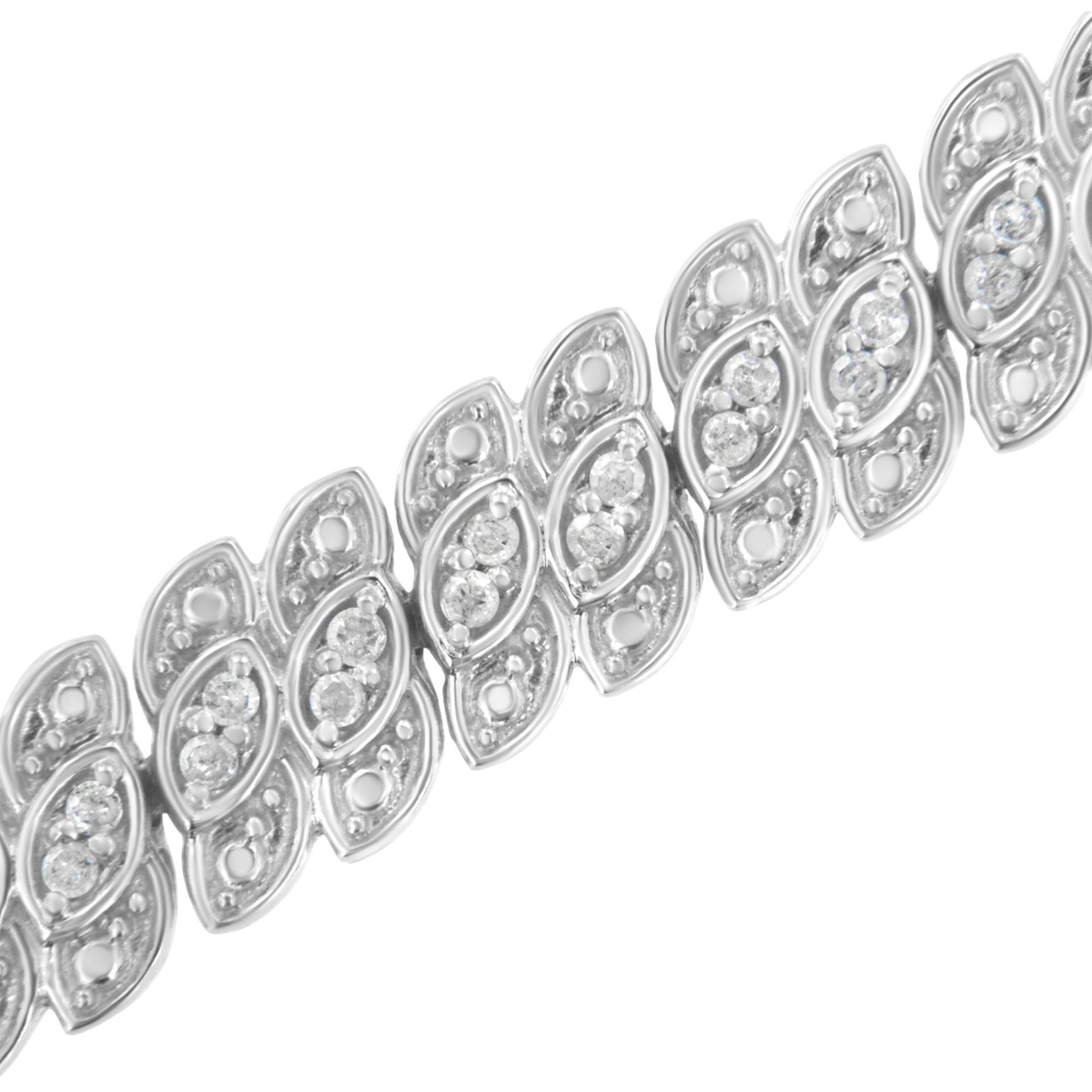 Close-up angled view of a white metal bracelet featuring leaf-shaped links with round white gemstones in prong settings.