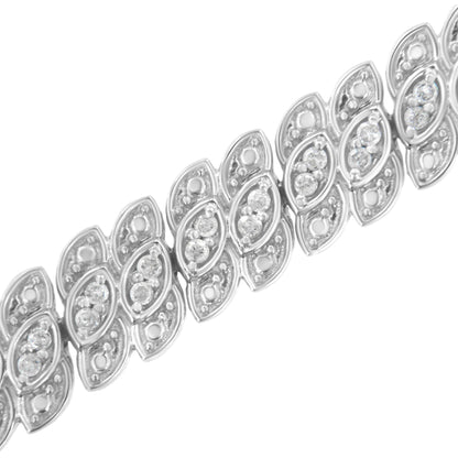 Close-up angled view of a white metal bracelet featuring leaf-shaped links with round white gemstones in prong settings.