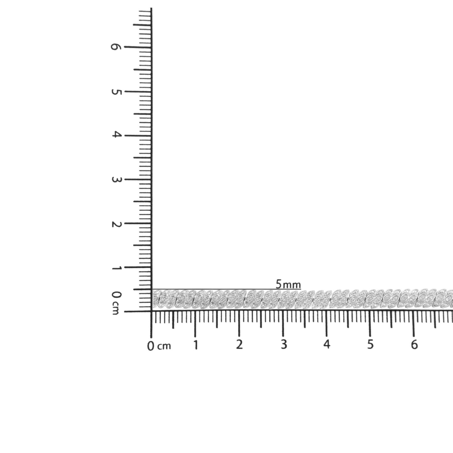 Bracelet with round white gemstones in prong setting on a ruler for size reference, top-down angle.