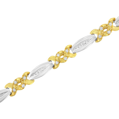 Close-up diagonal view of a yellow and white metal bracelet featuring round white gemstones in channel and prong settings.