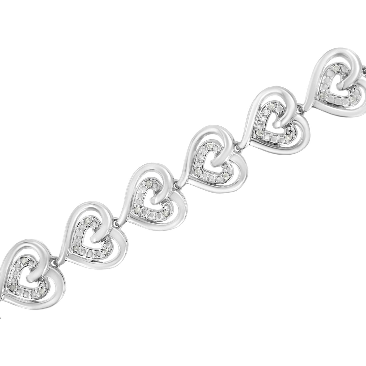 Diagonal close-up of a white metal bracelet featuring linked heart shapes with round white gemstones in prong settings.