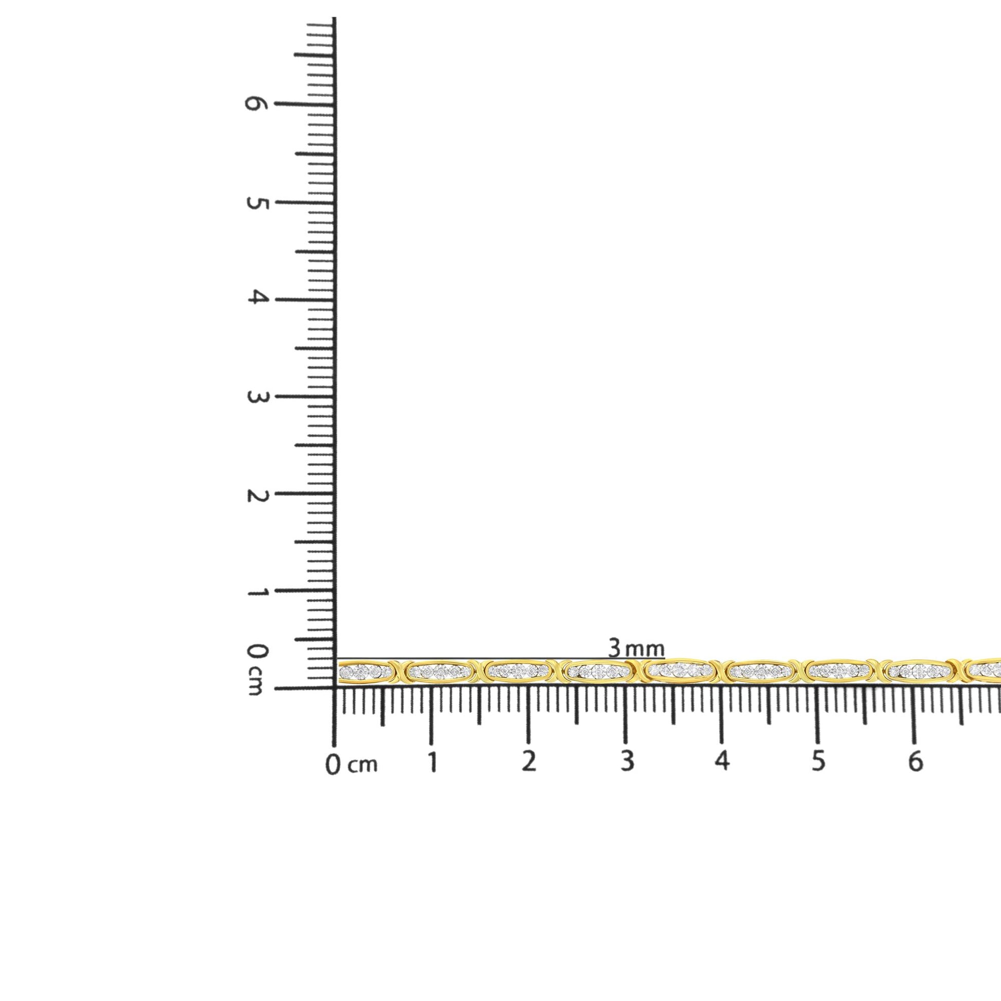 Close-up image of a yellow bracelet with multiple links, each adorned with white round gemstones in miracle settings, displayed flat on a ruler for size reference.