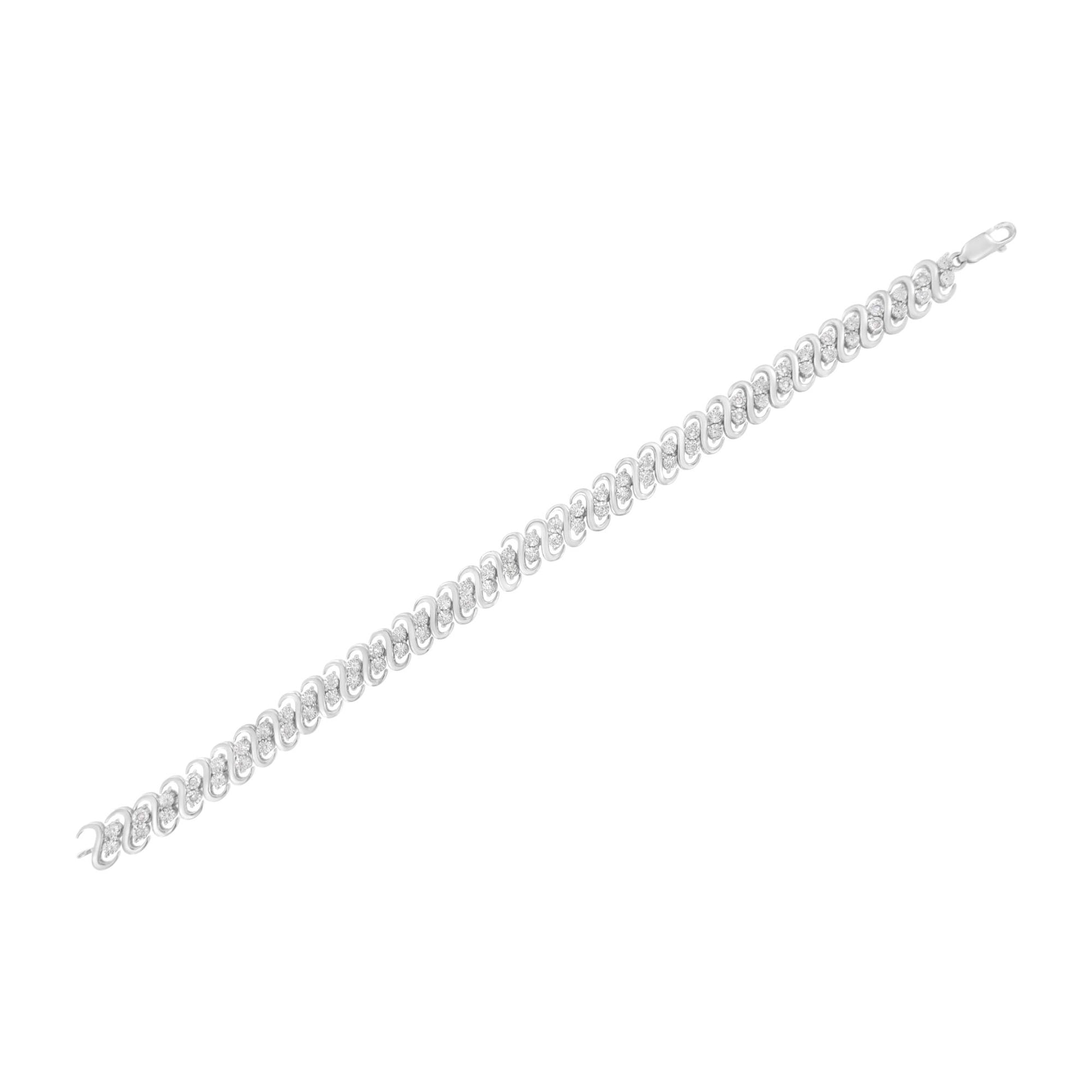 White metal bracelet with linked curvy design and white round gemstones in miracle setting, shown in a diagonal flat lay angle.