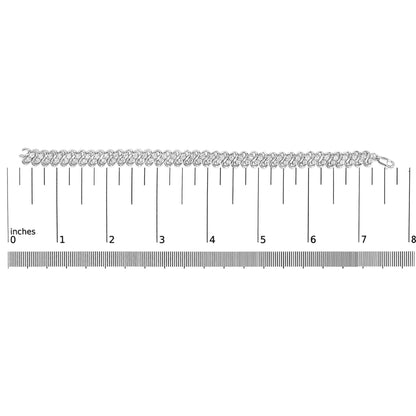 White metal bracelet with round white gemstones in miracle setting, laid flat on a ruler for size reference, top-down angle.