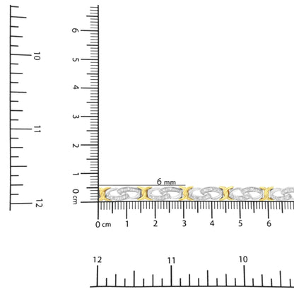Bracelet with alternating yellow and white metal links, white round gemstones in channel setting on white links, shown in close-up on ruler for size reference, side angle.