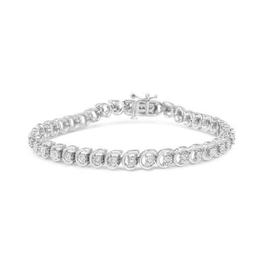 White metal bracelet with round white gemstones in miracle setting, shown from front angle on a white background.