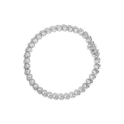 White metal bracelet with round white gemstones in miracle setting, shown from top angle on white background.