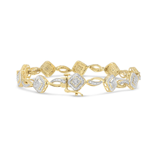 Yellow metal bracelet with alternating diamond-shaped links accented with round white gemstones, shown in a front-facing close-up angle.