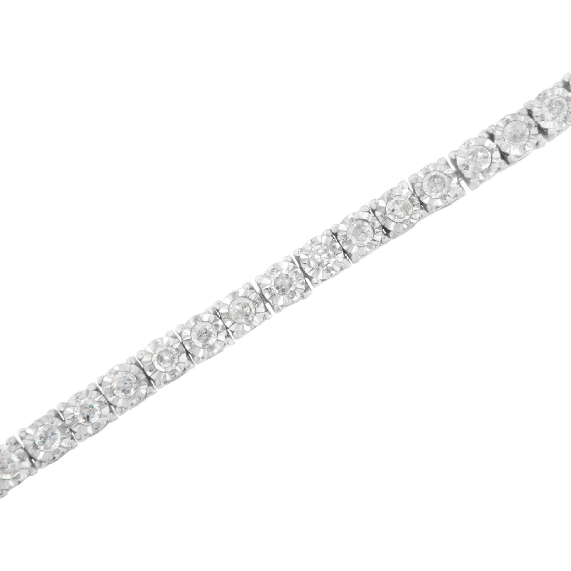 White metal bracelet with round white gemstones in miracle setting, shown at a slight diagonal angle.