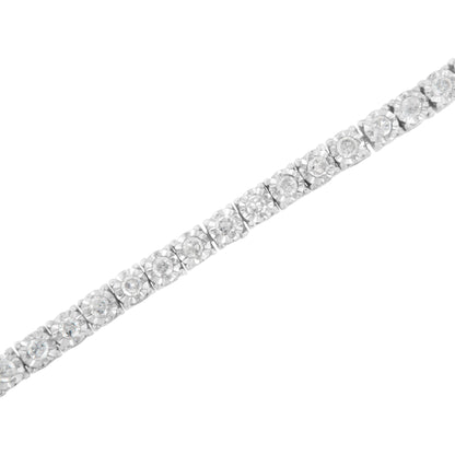 White metal bracelet with round white gemstones in miracle setting, shown at a slight diagonal angle.