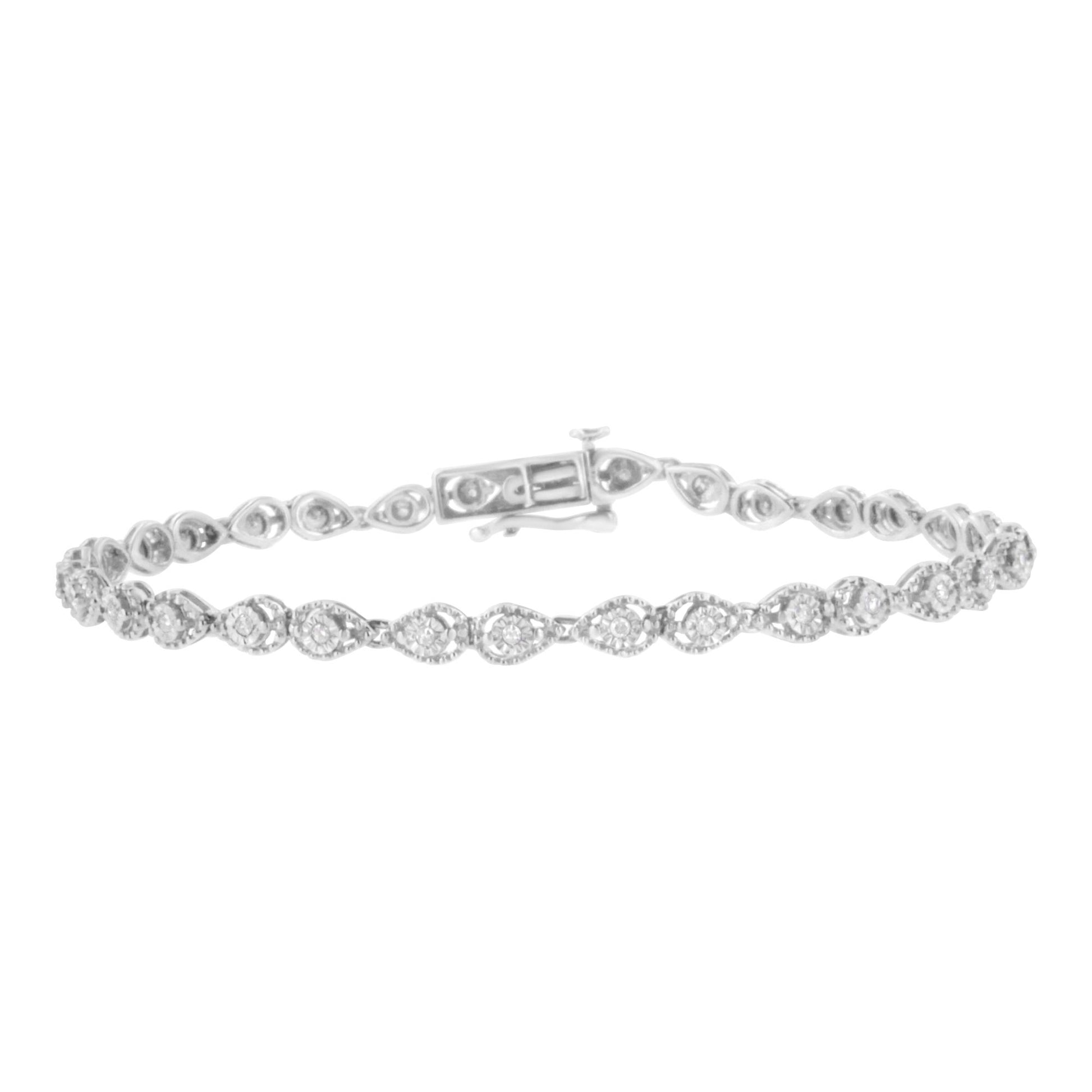 Close-up front angle of a white metal bracelet featuring round white gemstones set in a miracle pattern along the band with a clasp visible.