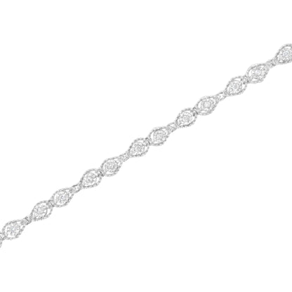 White metal bracelet with alternating round white gemstones in miracle settings forming an intertwined pattern, shown in a diagonal top-down view.