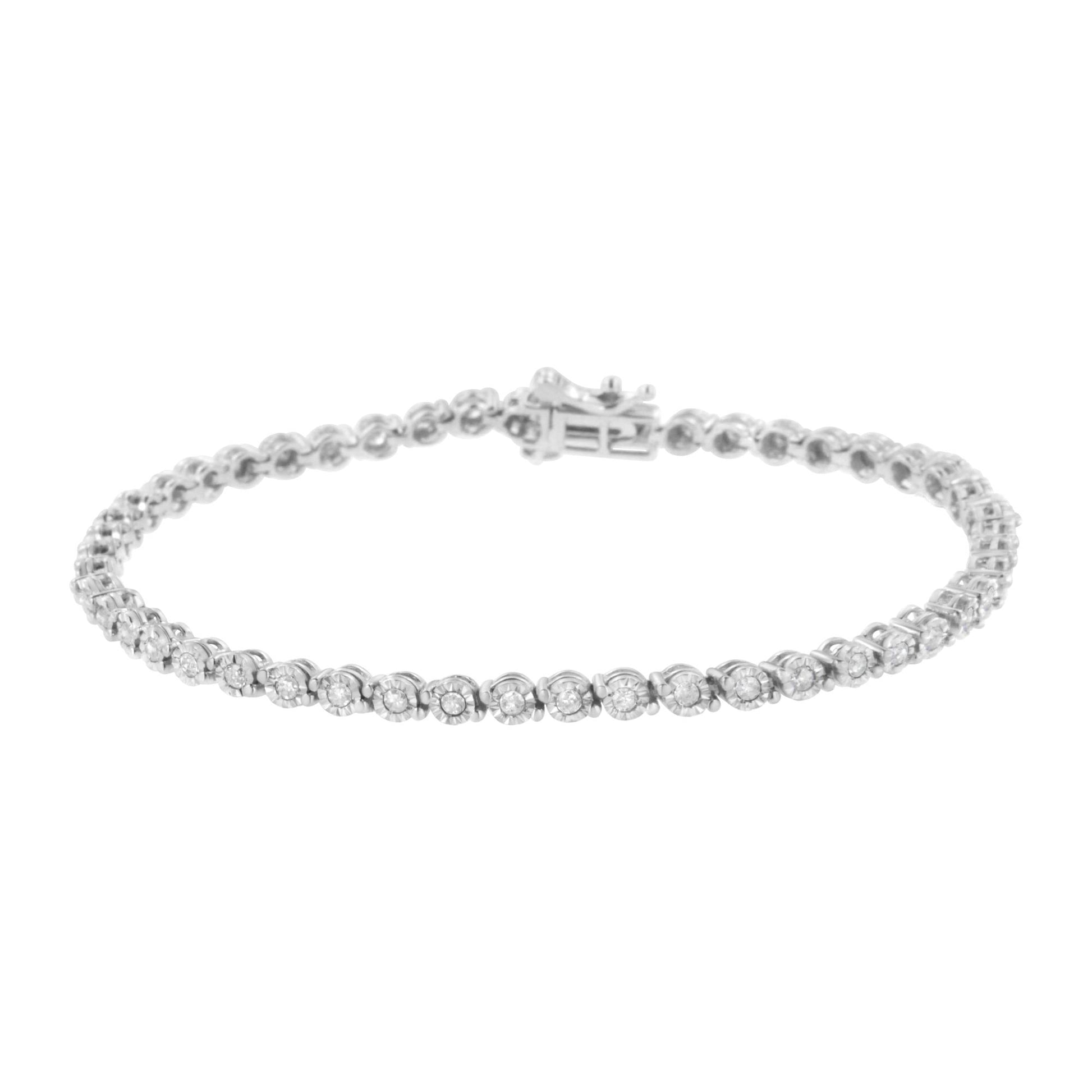 White metal bracelet with round white gemstones in miracle setting, shown in a front angled view.