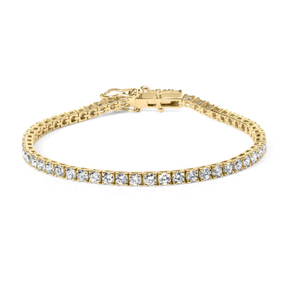 Yellow metal bracelet with round white gemstones in 4-prong settings, shown from a front angle.