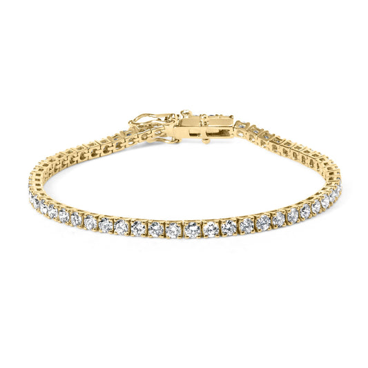 Yellow metal bracelet with round white gemstones in 4-prong settings, shown from a front angle.