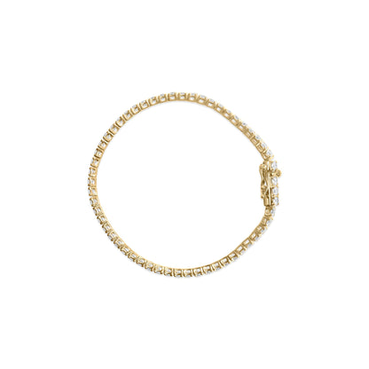 Yellow metal bracelet with white round gemstones set in 4-prong settings, shown from top angle on a white background.