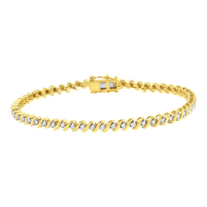 Yellow metal bracelet with round white gemstones set in a twist pattern, shown from a front angle.