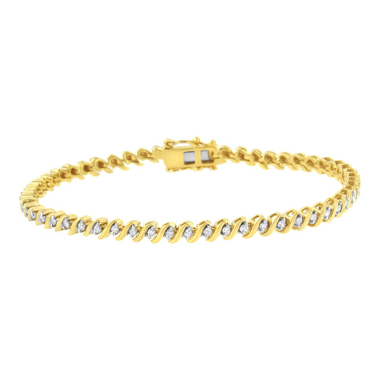 Yellow metal bracelet with round white gemstones set in a twist pattern, shown from a front angle.