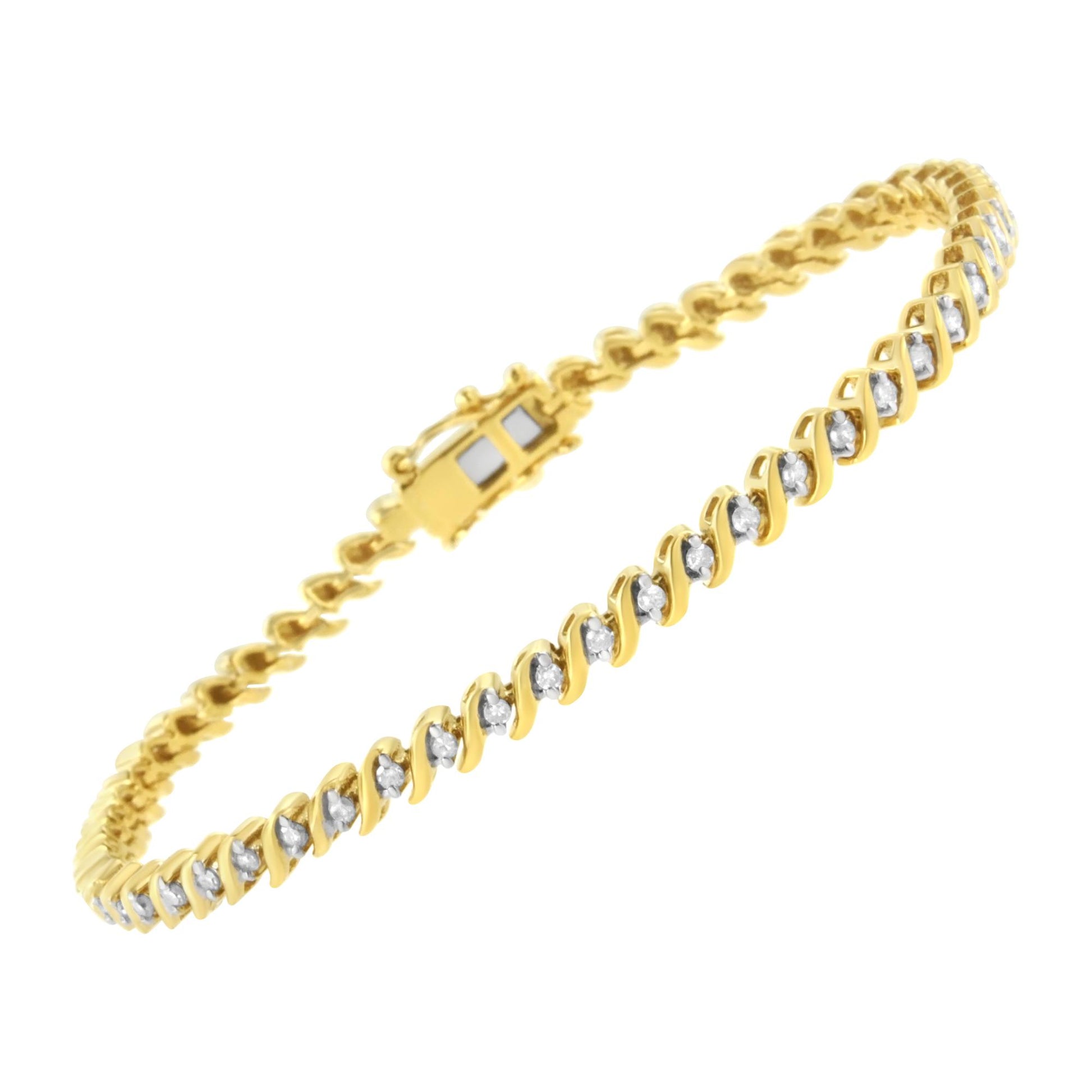 Yellow metal bracelet with round white gemstones in 2-prong settings, shown at an angled close-up.