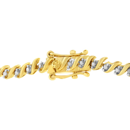 Close-up angled view of a yellow bracelet with twisted links, each set with small white round gemstones in 2-prong settings, showing the clasp.