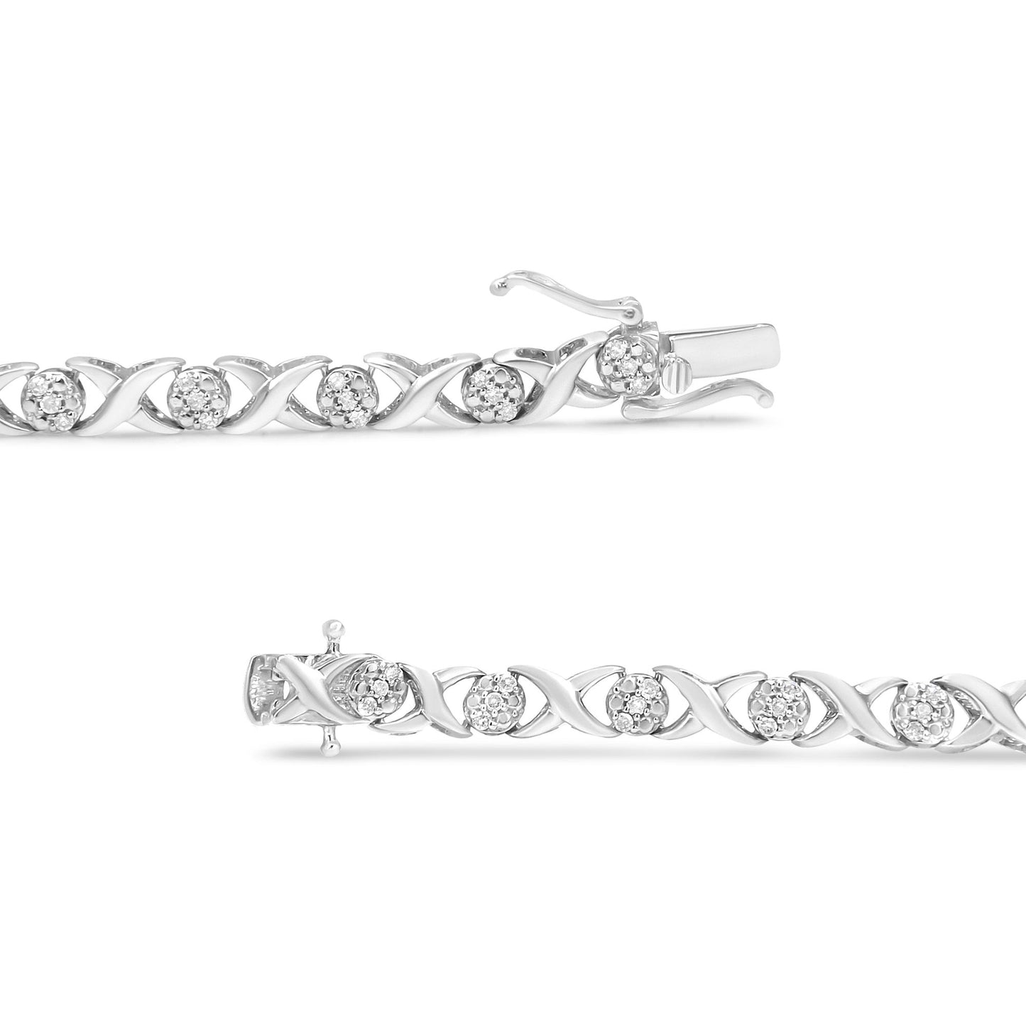 White metal bracelet with alternating linked X shapes and clusters of round white gemstones in prong settings, shown in a close-up side angle.