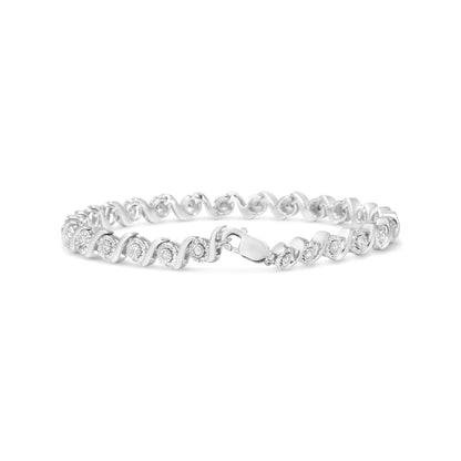 White metal bracelet with two rows of round white gemstones in miracle and pave settings, shown from a slight side angle.